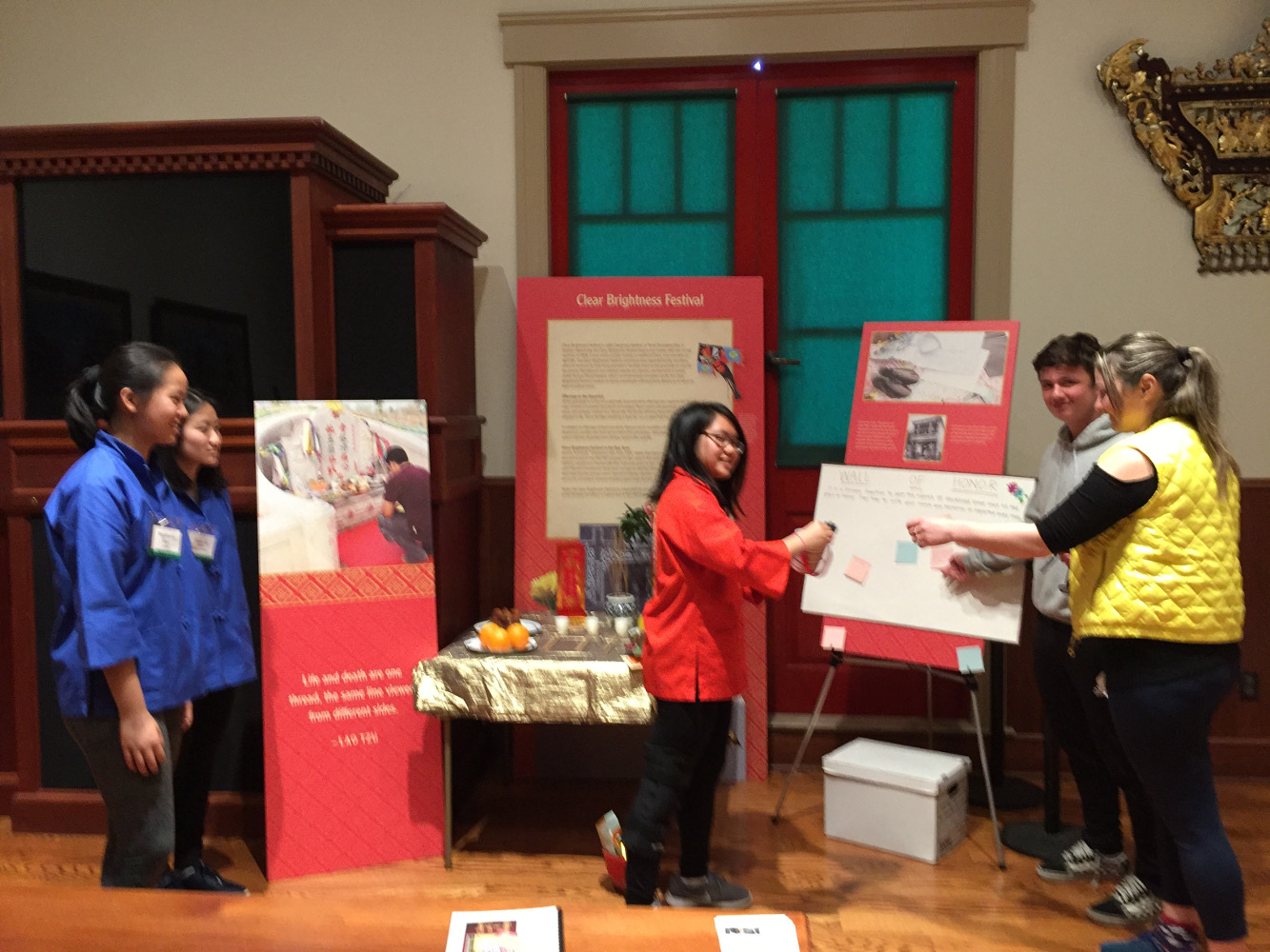 Student Docents explaining Museum Ching Ming Exhibit